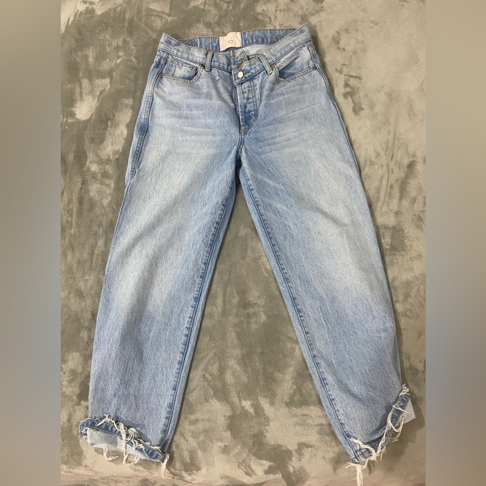 Size 30, asymmetrical jeans.